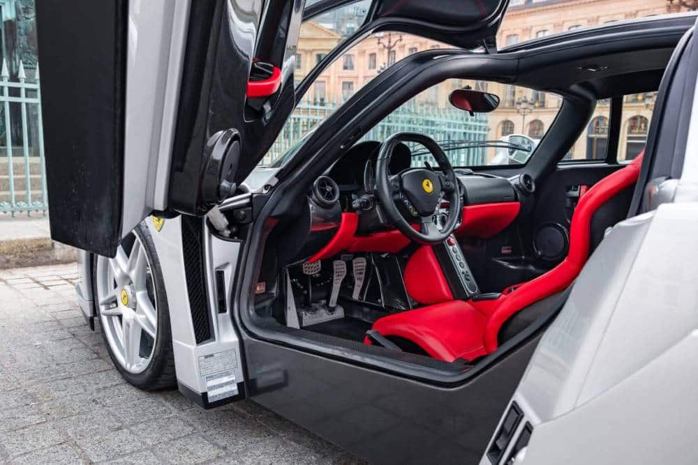 https://cdn.autogreeknews.gr/wp-content/uploads/2026/03/2004-Ferrari-Enzo-Auction-Silver-11-2048x1366-1.jpg