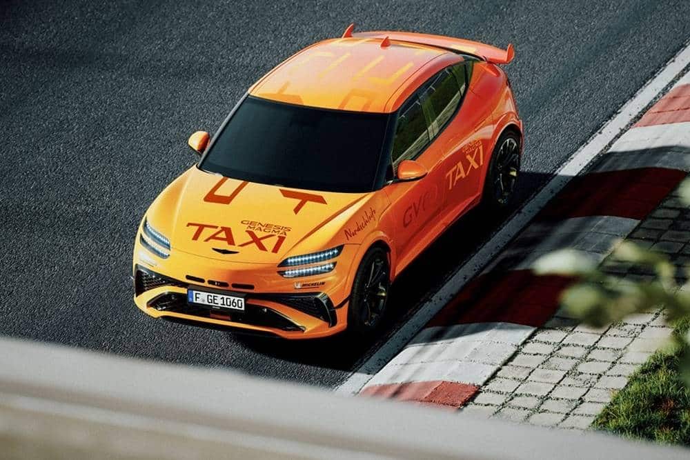 https://cdn.autogreeknews.gr/wp-content/uploads/2026/07/genesis-gv60-magma-nurburgring-taxi-5.jpg